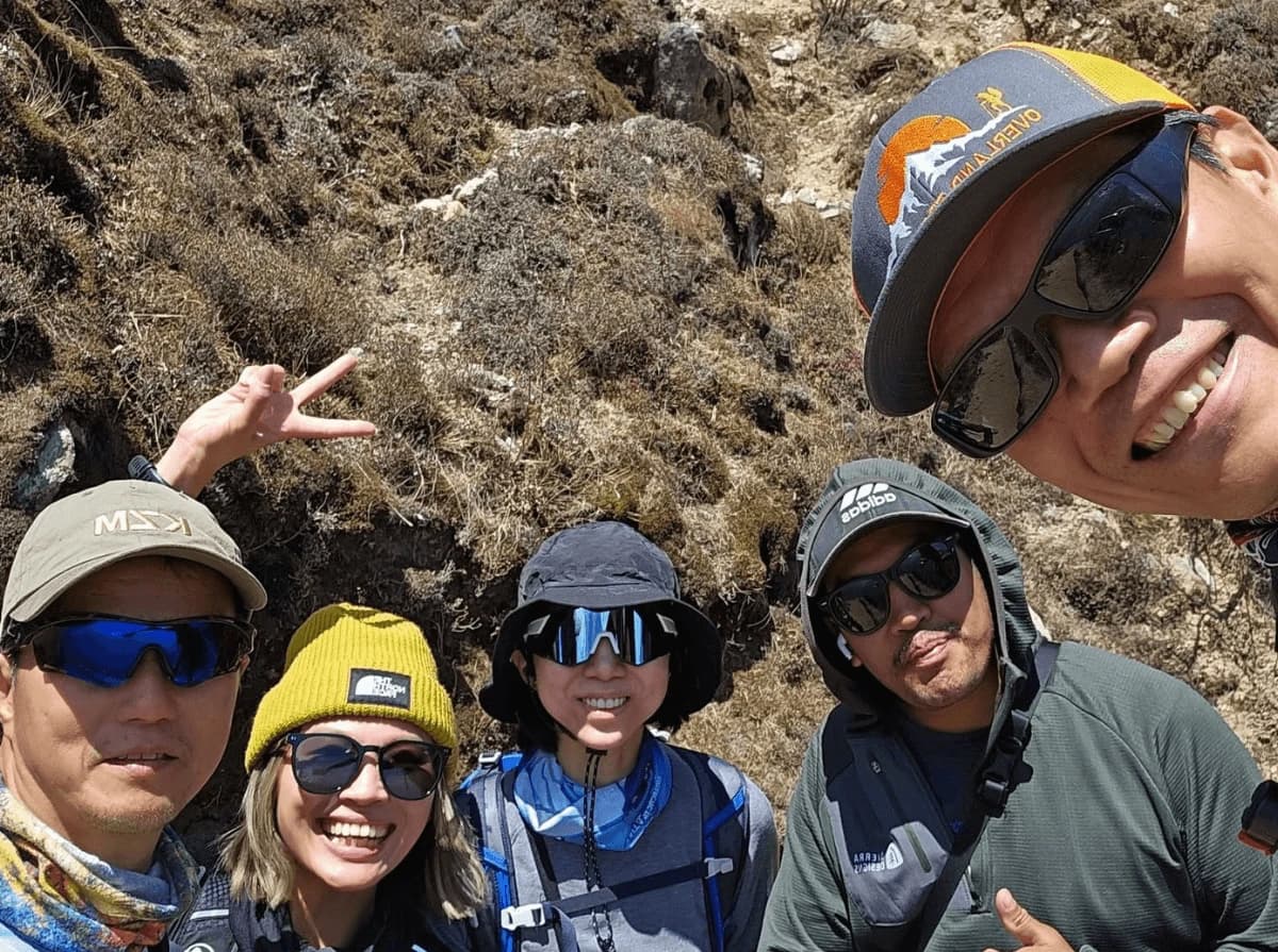 Trekkers from Overland Trek Nepal enjoying the Everest Base Camp Group Joining Trek with stunning Himalayan mountain views along the Khumbu trail.