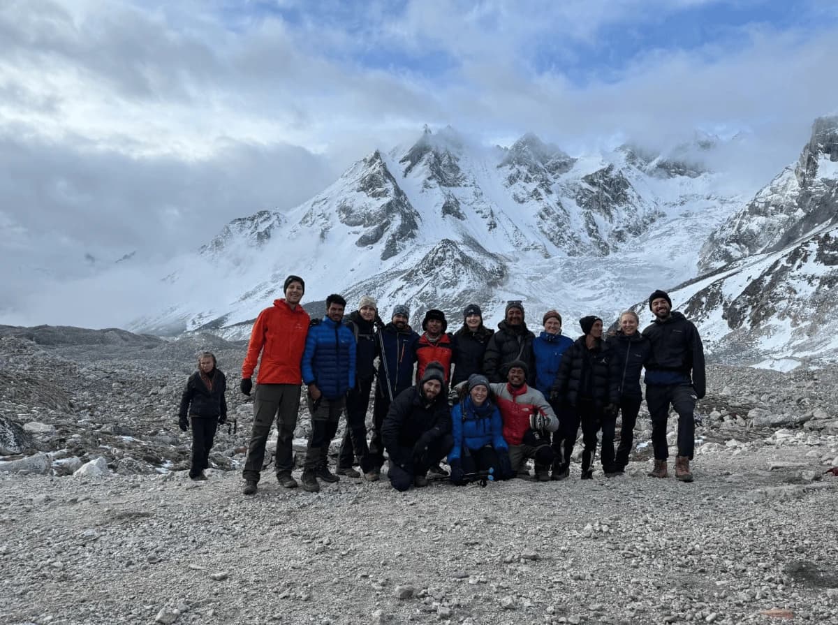 Trekking group enjoying the mountain views at Manaslu Base Camp during the Manaslu Circuit Trek