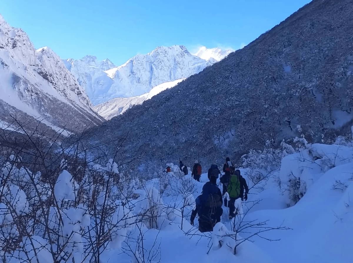 Snow-covered trail and mountain scenery during the Manaslu Circuit Trek in winter, Nepal.