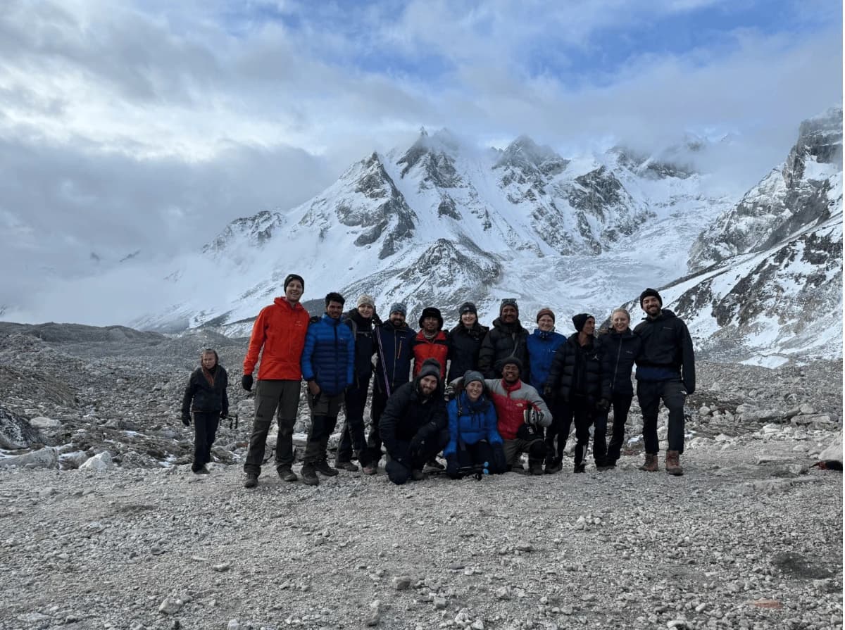 Trekkers at Manaslu Base Camp with stunning views of Mount Manaslu during the Manaslu Annapurna Circuit Trek.