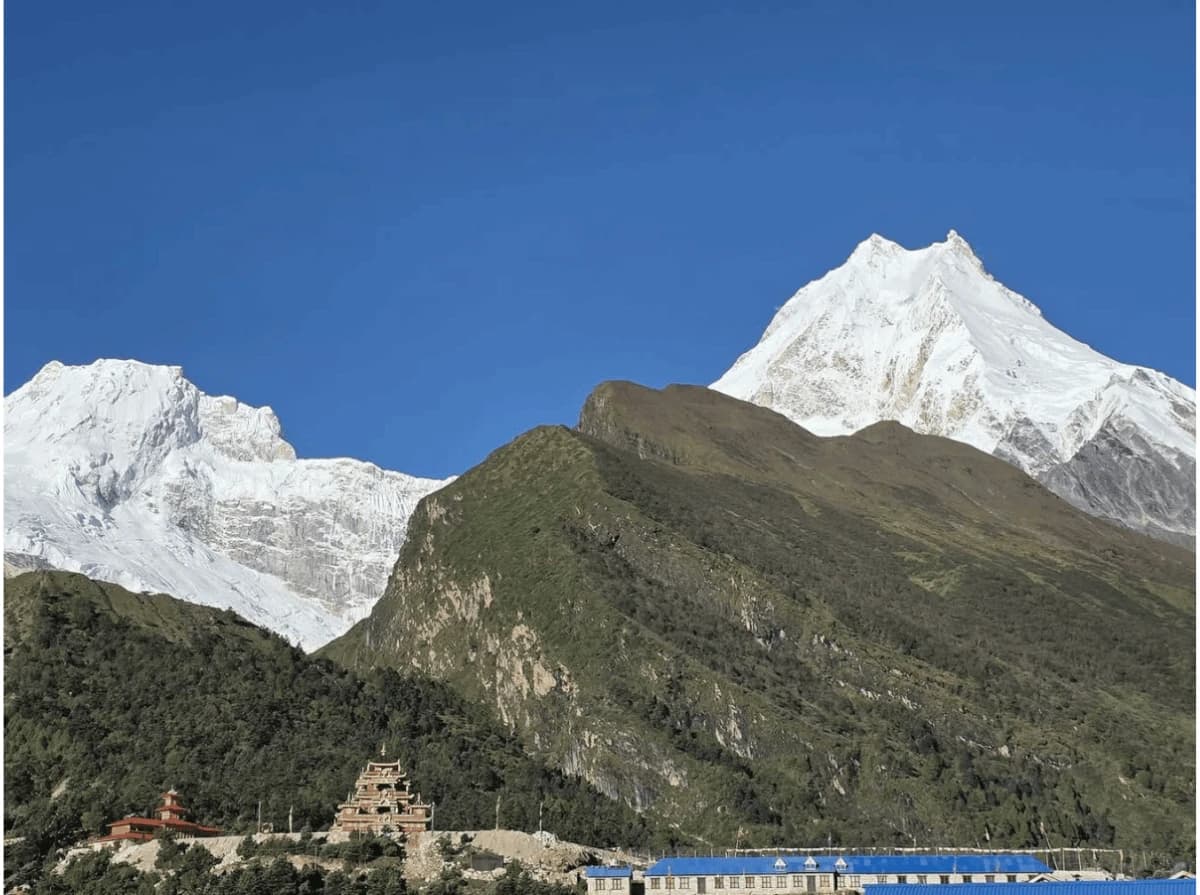 Panoramic view of Mount Manaslu and Syala Gompa during the 14 Days Manaslu Circuit Trek in Nepal.