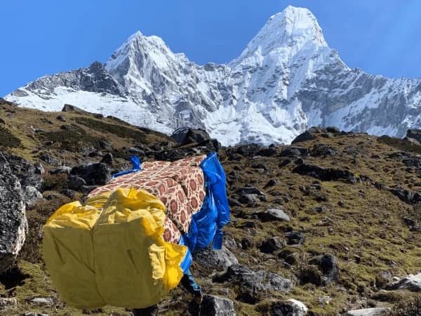 Porter carring goods for camping